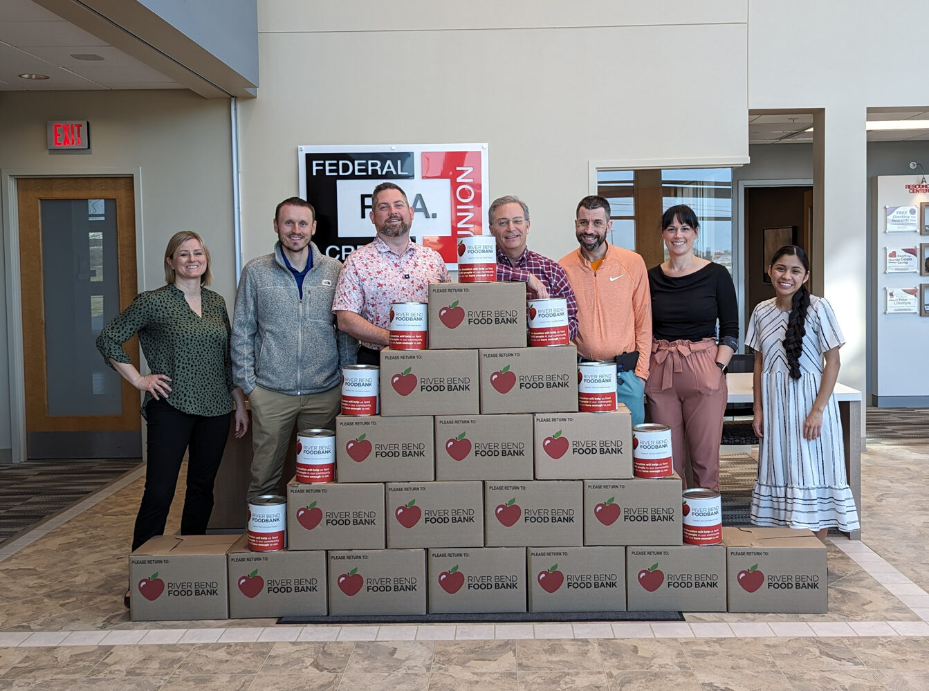 R.I.A. employees dressed in sports apparel for the food drive fundraiser